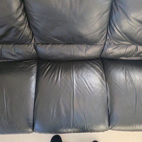 Leather three-seater sofa