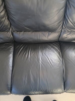Leather three-seater sofa