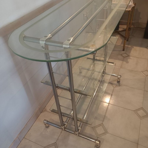 Glass professional shelving unit used with sandblasted glass and nickel frame