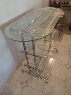 Glass professional shelving unit used with sandblasted glass and nickel frame