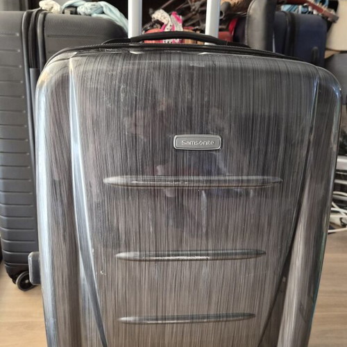 Samsonite hard suitcase used with TSA lock and 4 wheels