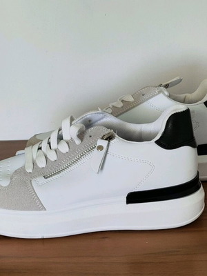 White athletic shoes with laces and zipper new