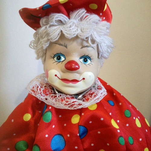 Porcelain clown used, 49cm tall, with clothes