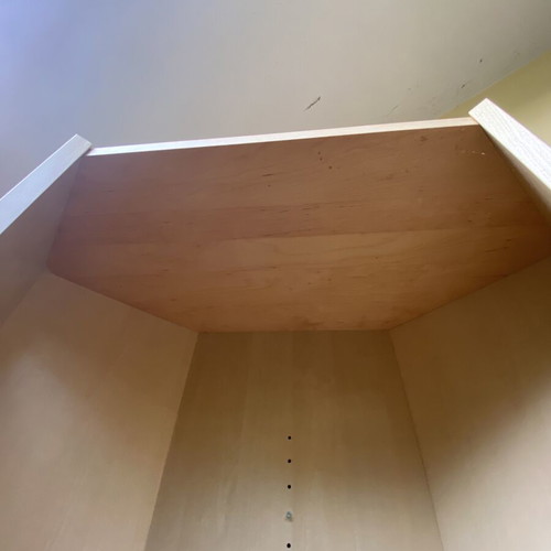 Polygonal beech-colored bookcase used, adjustable shelves