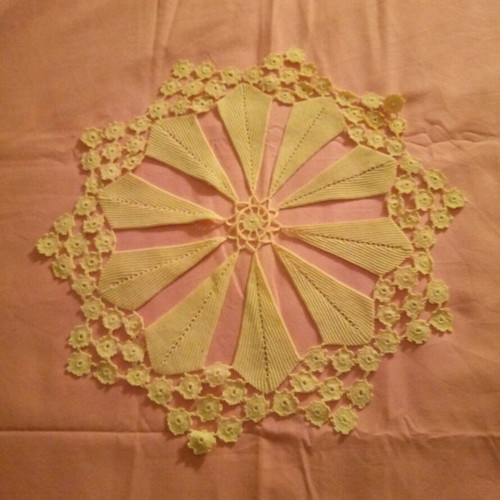 Knitted doily used with 10 shaped leaves, beige color