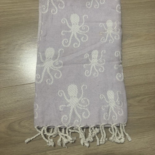 Pestemal beach towel used with octopus pattern and fringes