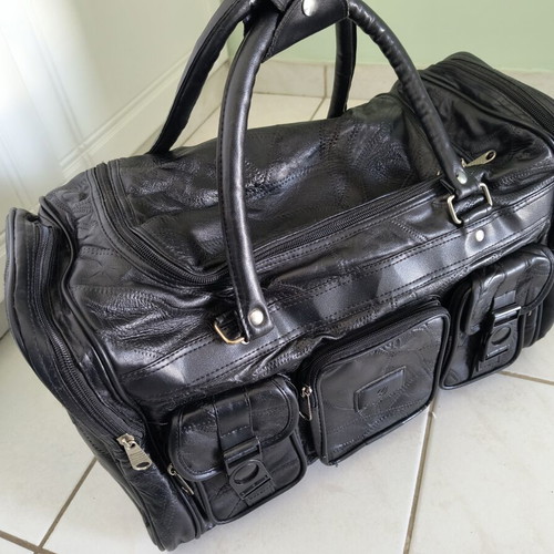 Travel bag like new, black, synthetic leather with extra strap