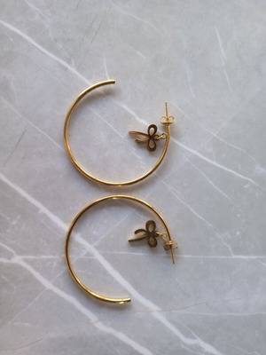 Hoop earrings in gold tone like new with bow detail