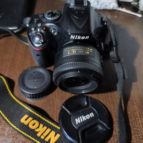 Nikon D5200 DSLR with Nikkor 35mm f/1.8G lens and accessories