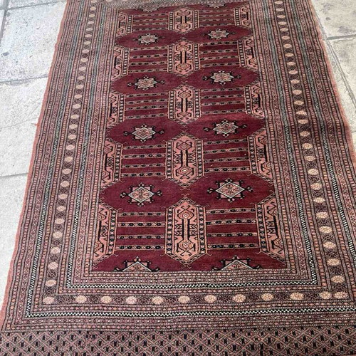 Handmade Bokhara rug with traditional Gul motifs, wool