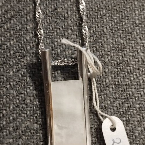 Silver women's necklace with minimal geometric pendant