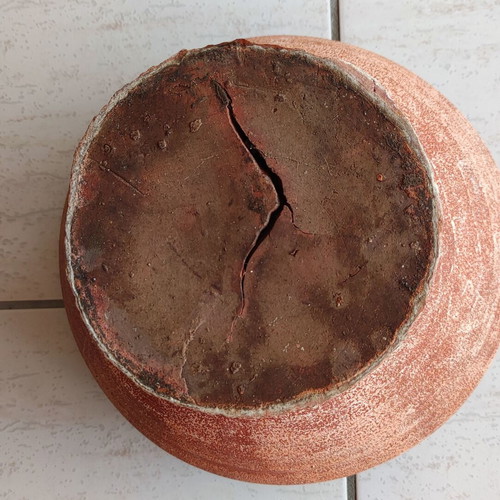 Clay flowerpot used with crack at base