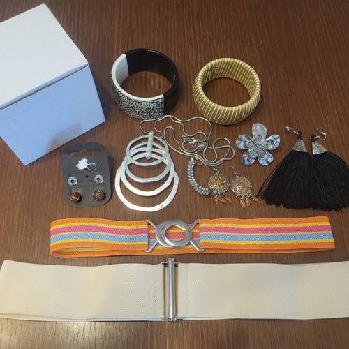 Jewelry box with bracelets, necklace, ring, earrings and belts