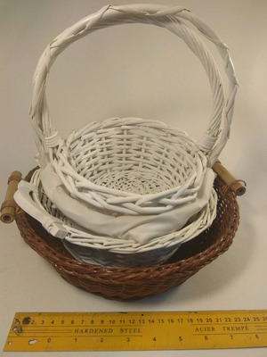 Basket set of four, three white and one brown, woven