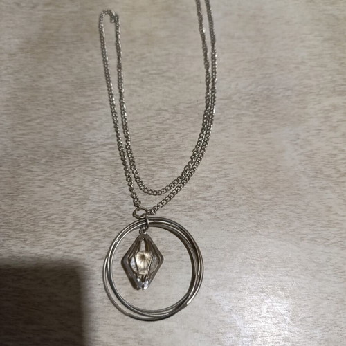 Silver necklace with transparent diamond used