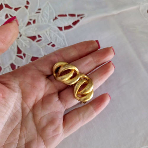 Clip-on earrings used, relief design, bronze tone