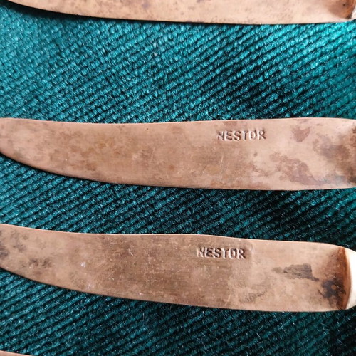 Set of used bronze knives and opener