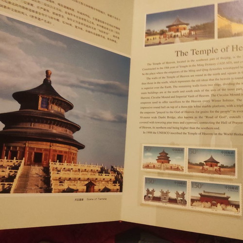Collectible gold-bound volume with China stamps and photos