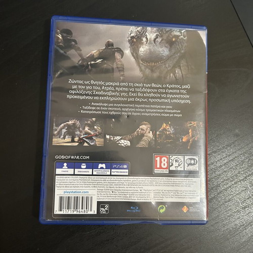 God of War PS4 game with cracked case and Need for Speed Heat