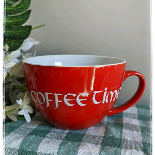Large mug used for coffee or cereals, red