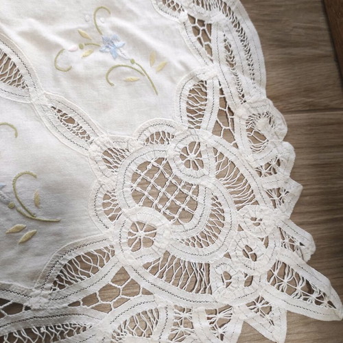 Small tablecloth used, white with lace and flowers