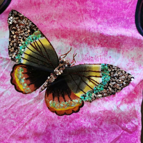 Women's pink polyester top with butterfly, size M