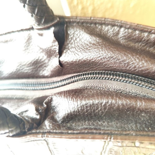 Brown handbag used, faux leather with damages near zipper