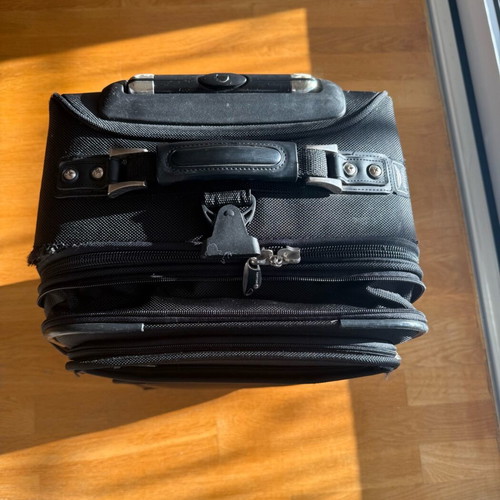 Delsey suitcase used with wheels small size black