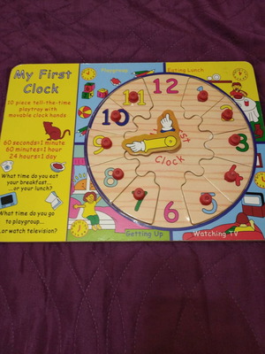 Educational wooden clock for small children used