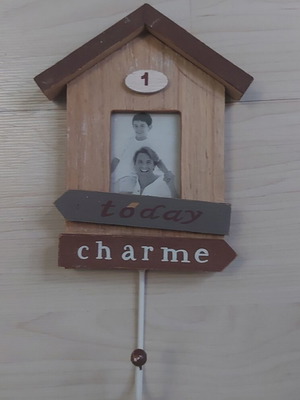 Wooden hanger like new with small defect