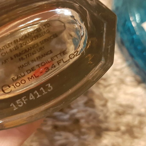 Empty Bentley and Kiton cologne bottles used