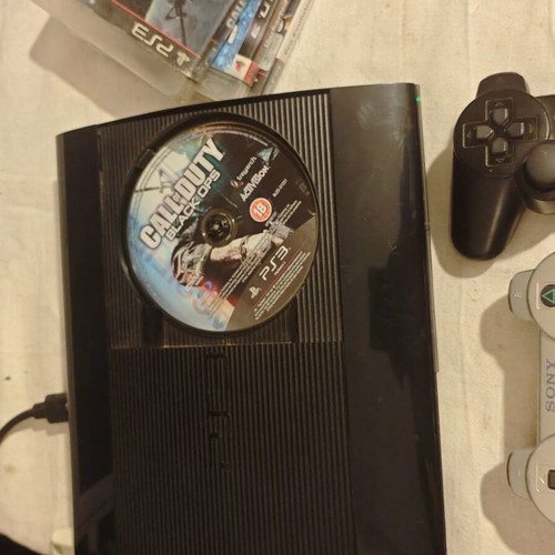 PlayStation 3 Super Slim console 1TB with controllers and games