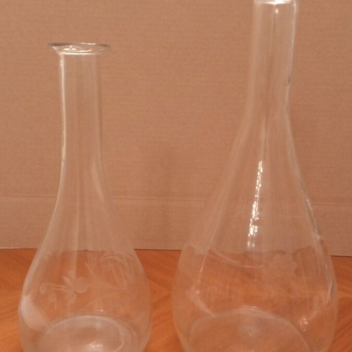 Vintage glass carafes with engraved floral design, pair