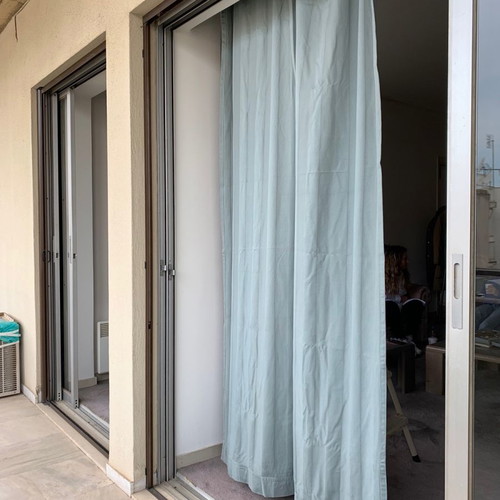 Gray striped curtains used, 3 panels