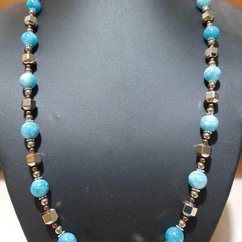 Necklace with dark blue larimar and gold hematite on steel