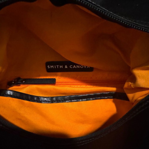Leather backpack like new, black with orange lining
