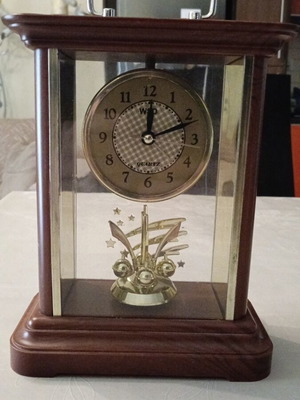 Vintage tabletop clock used with wooden brown base