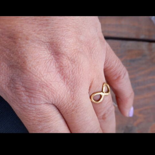 Gold infinity ring like new, made of steel
