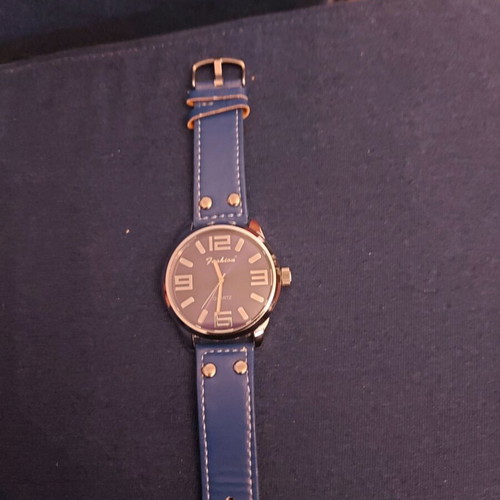 Women's watch like new with blue strap and metal case