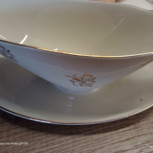Gravy boat and deep plate used with floral patterns