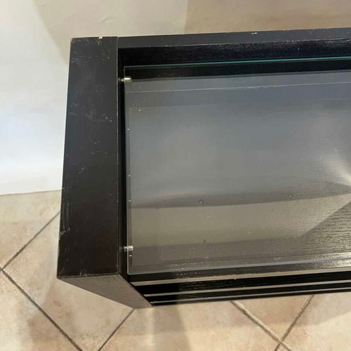 Wooden furniture with glass surface and two shelves on wheels used