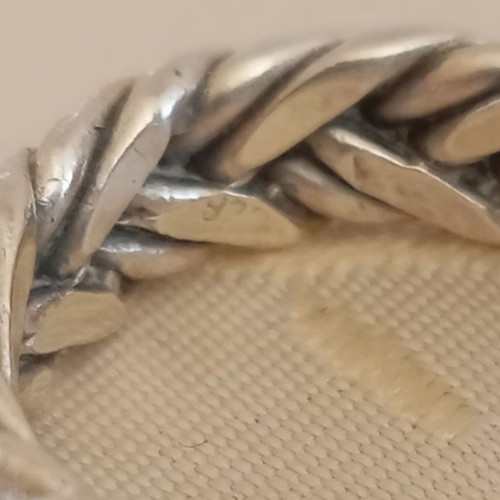 Silver solid ring used with braided design