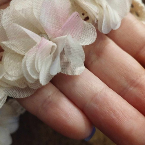 White hair ribbon wreath used for flower girl with flowers