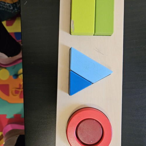 Hape shape puzzle used with marks from small hands