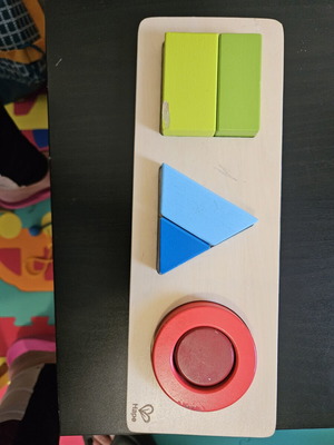 Hape shape puzzle used with marks from small hands