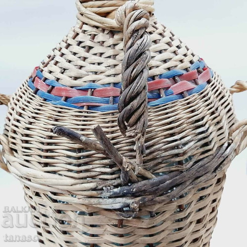 Large vintage glass demijohn with wicker cover, 30 liters, used