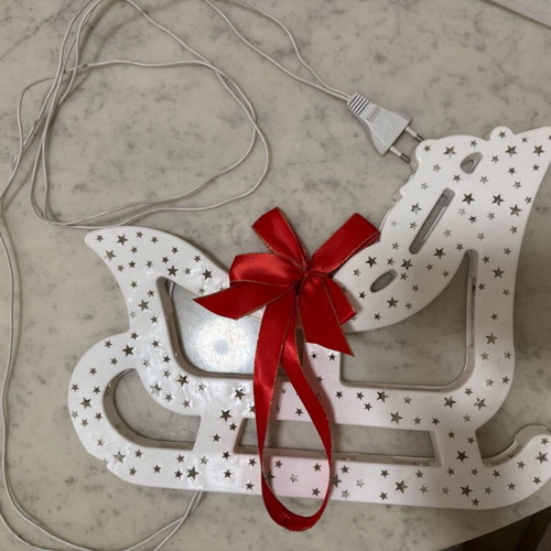 Christmas sleigh used with bow and light
