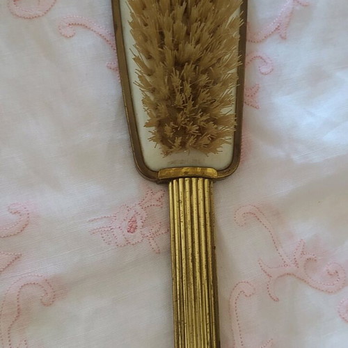 Old metal brush with embroidery used