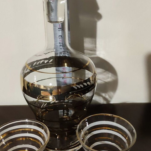 Vintage glass decanter set with 2 glasses used, gold decorations