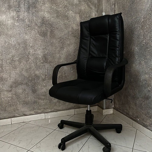 Black executive office chair with armrests and wheels